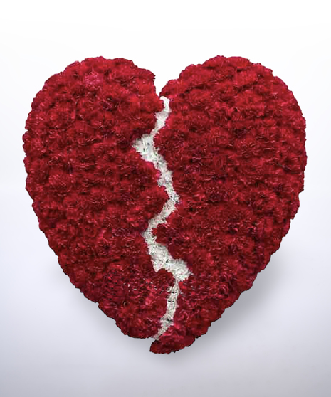 broken heart in red and white carnations