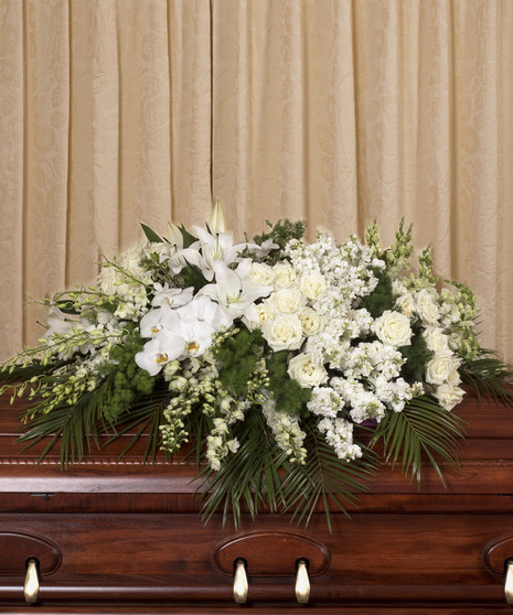 elegant white flowers in casket cover