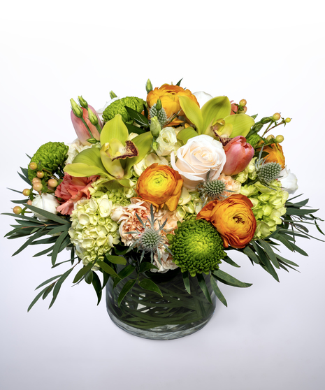 yellow, peach, orange, and green flower arrangement