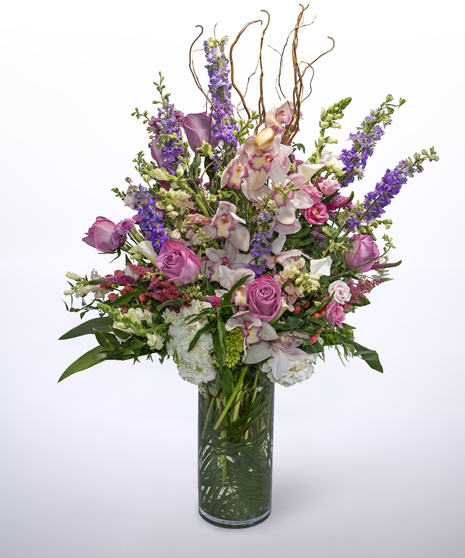 hydrangea, snap dragon, lisianthus, larkspur, roses, veronica and cymbidium orchids