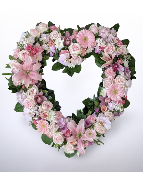 pink and white heart-shaped wreath for funeral