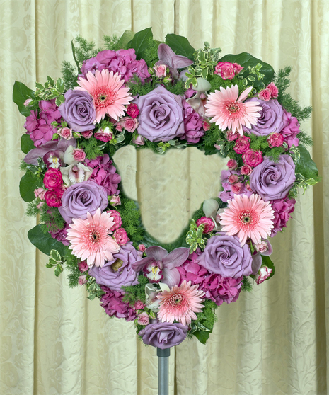 open heart created with flowers in soft and subtle colors