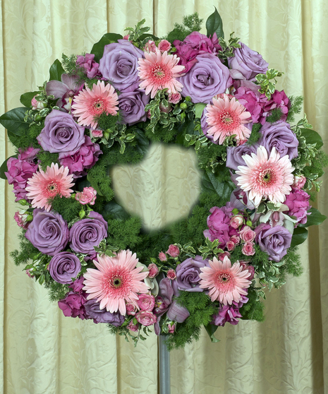 soft and subtle flowers in a standing funeral wreath