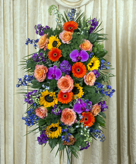 Vivid beauty flowers in a standing funeral easel spray